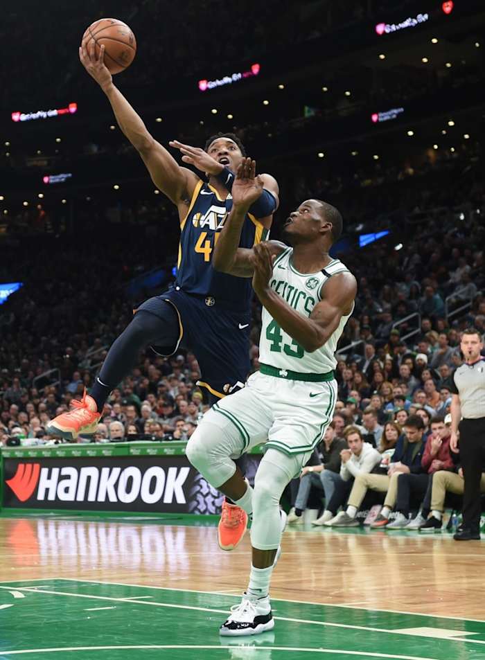 Donovan Mitchell (45) with a layup against the Celtics